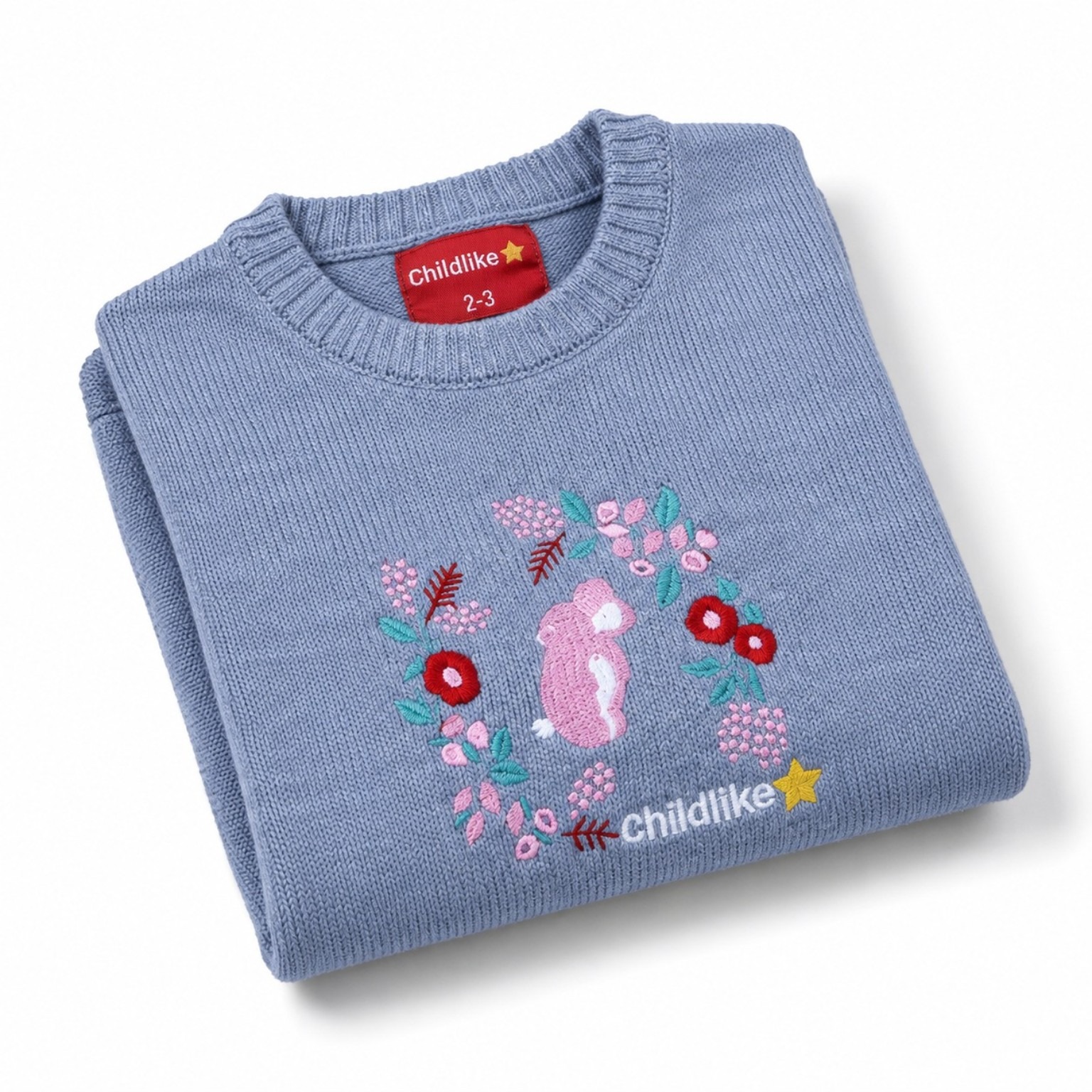 Folded grey-blue children’s sweater showing the pink rabbit and floral embroidery, crew neck and Childlike label.