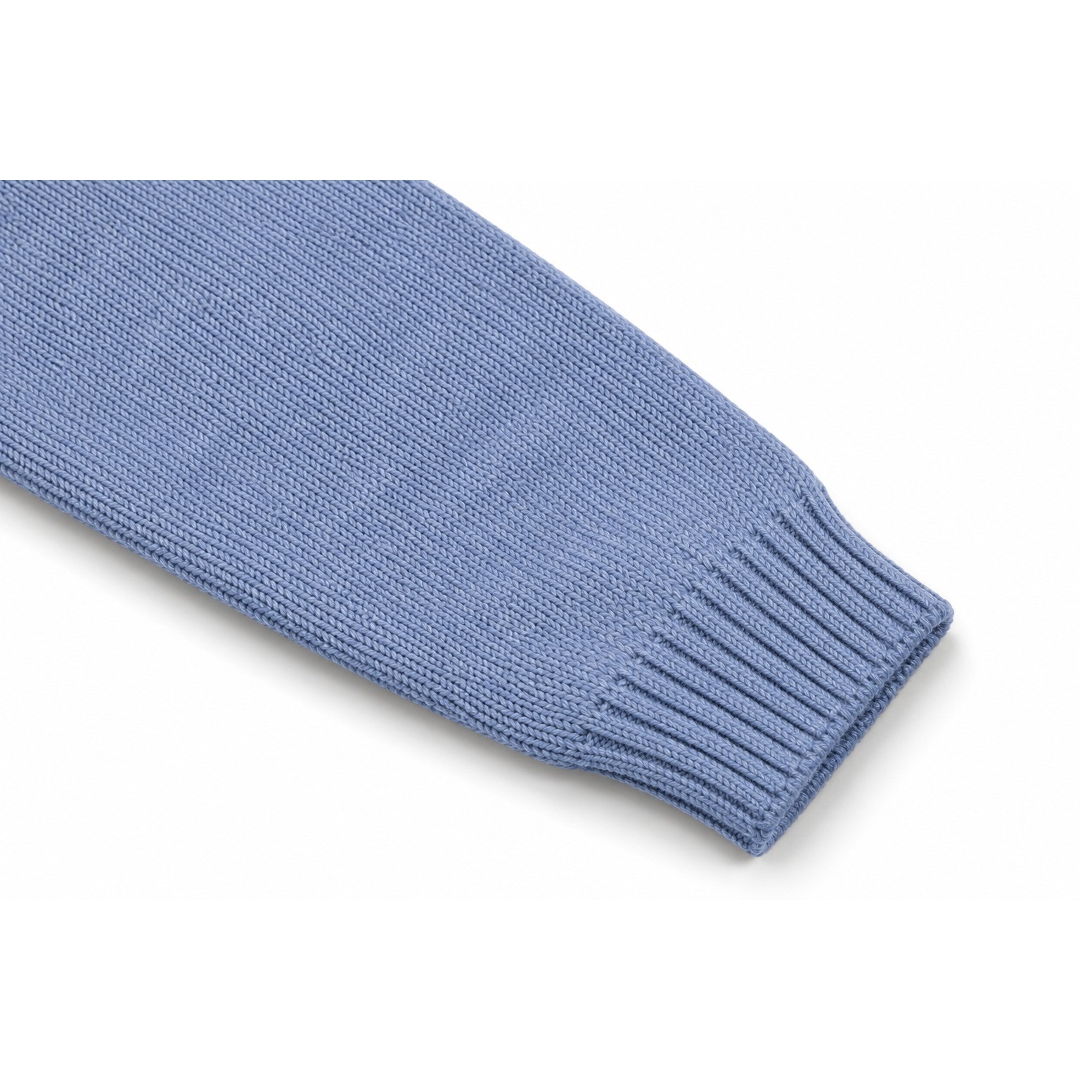 Close-up of the grey-blue Bunny Garden Embroidered Sweater sweater sleeve with a ribbed cuff.